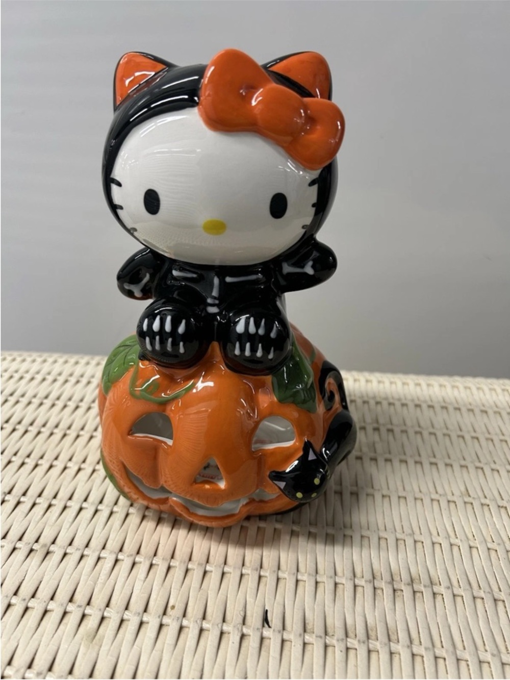 Sanrio Hello Kitty Pumpkin Figurine in Orange & Black with Green Accents